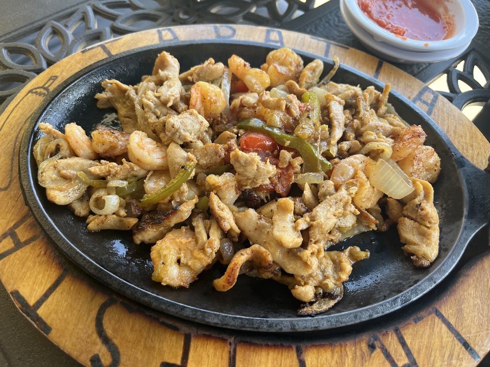 A spread of tacos and sides