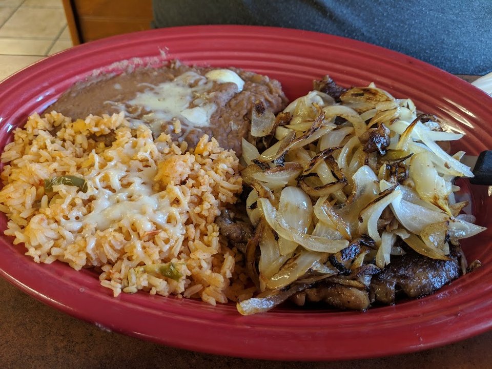 Printed menu with quesadillas and burritos